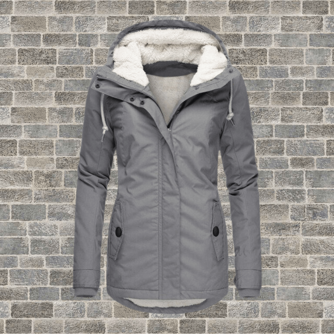Stylish women's fur-lined long winter coat, providing ultimate warmth and fashion for chilly days.