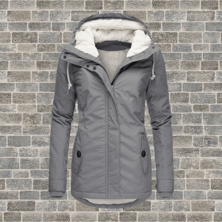 Stylish women's fur-lined long winter coat, providing ultimate warmth and fashion for chilly days.