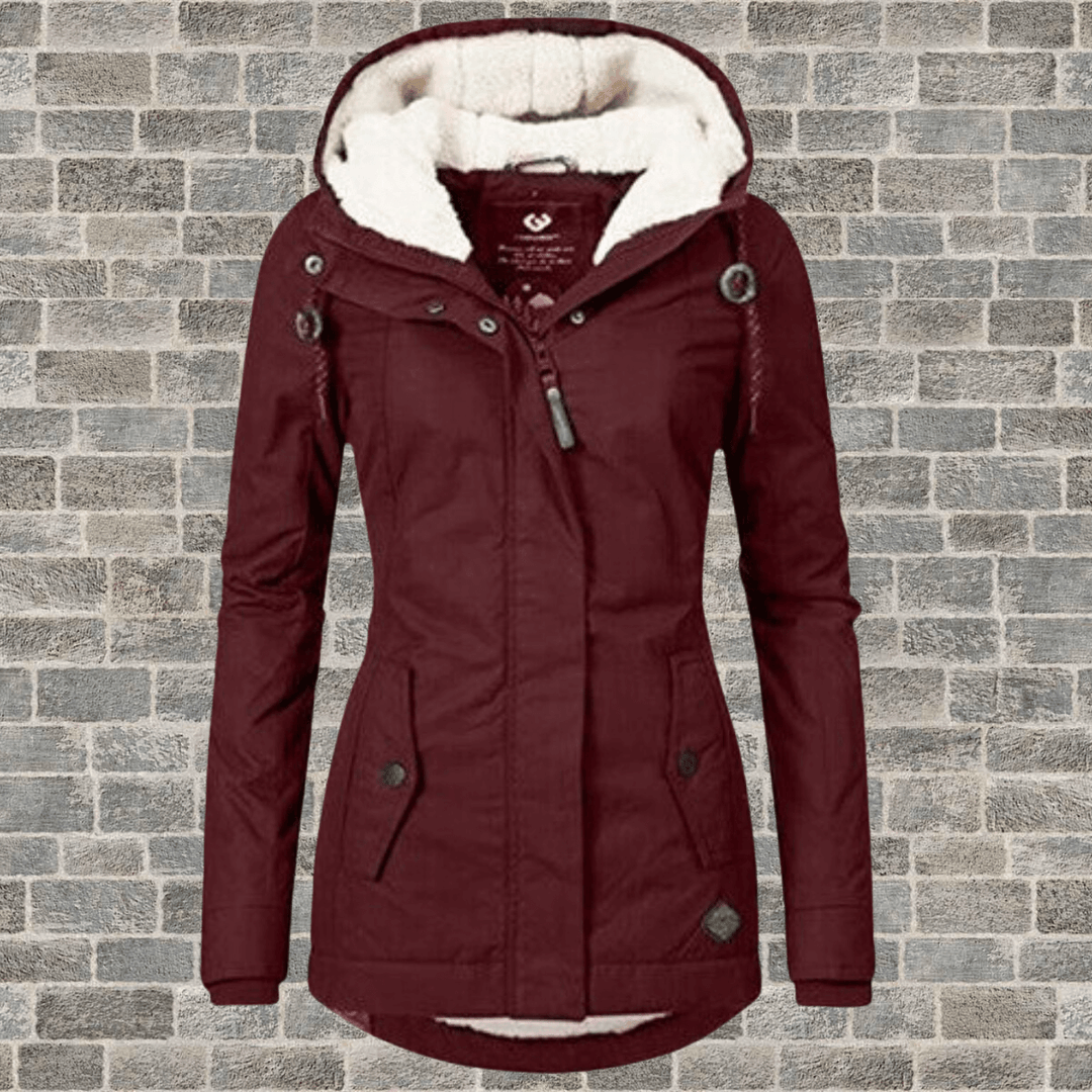 Fashionable women's long coat with luxurious fur lining, an elegant choice for winter warmth and style.