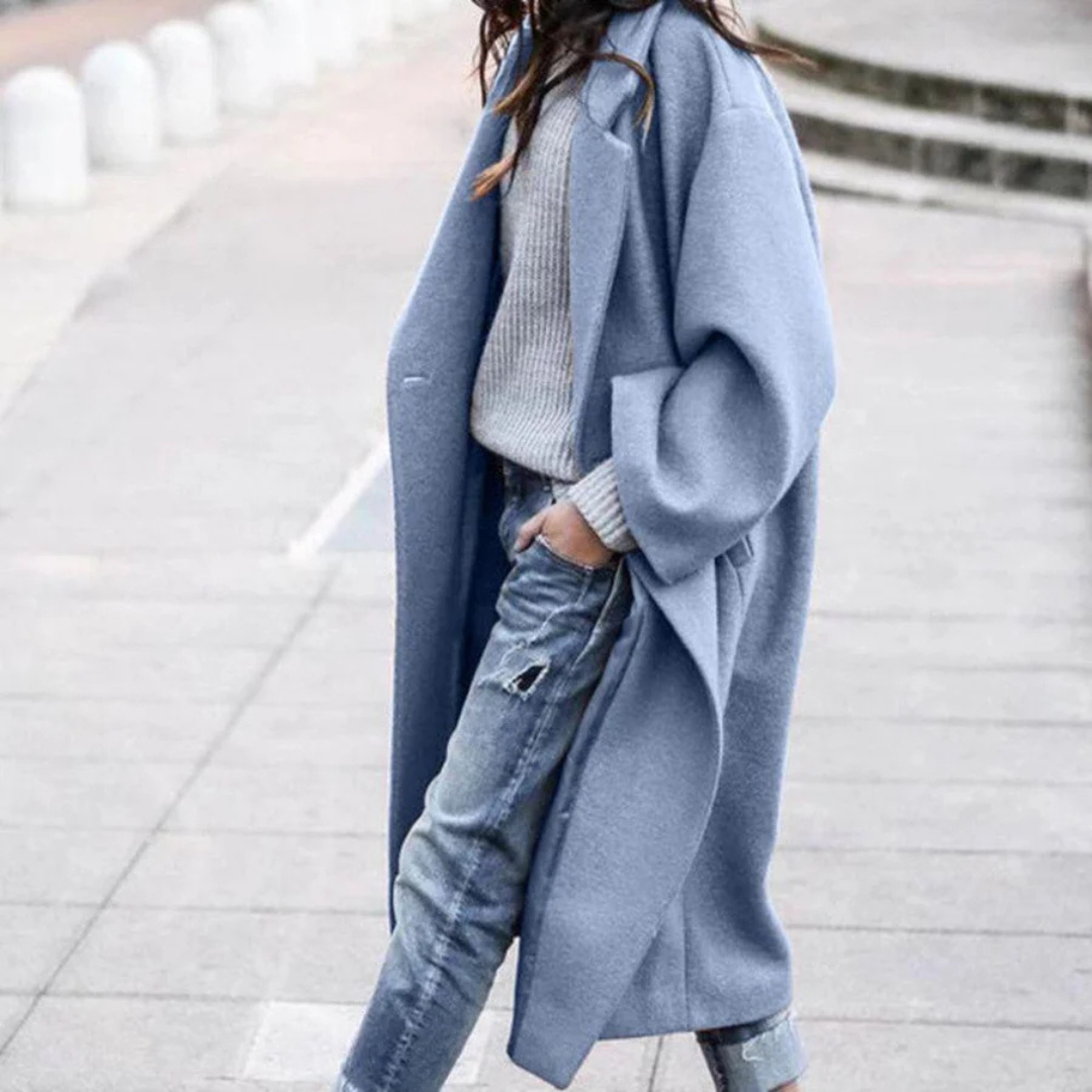 Elegant women's long winter trench coat, perfect for luxurious warmth and stylish cold weather outerwear.