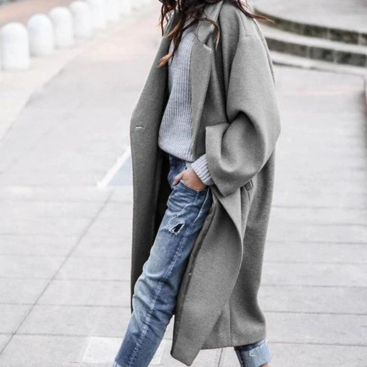 Stylish women's long trench coat, ideal for fall & winter fashion, offering elegant outerwear and warmth.