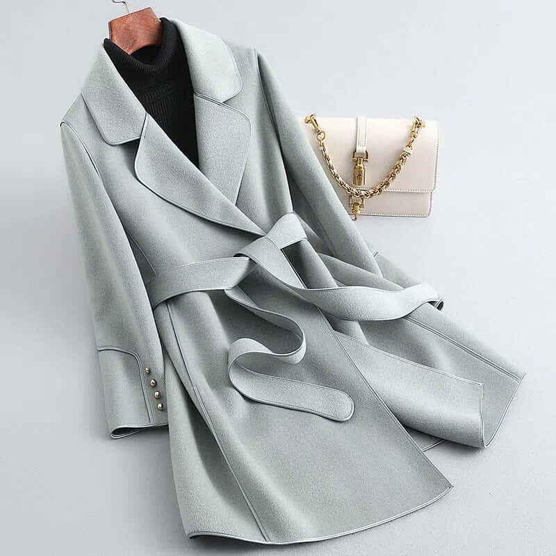 Fashionable women's long wool winter coat, offering elegant style and warmth for chilly days and evenings.