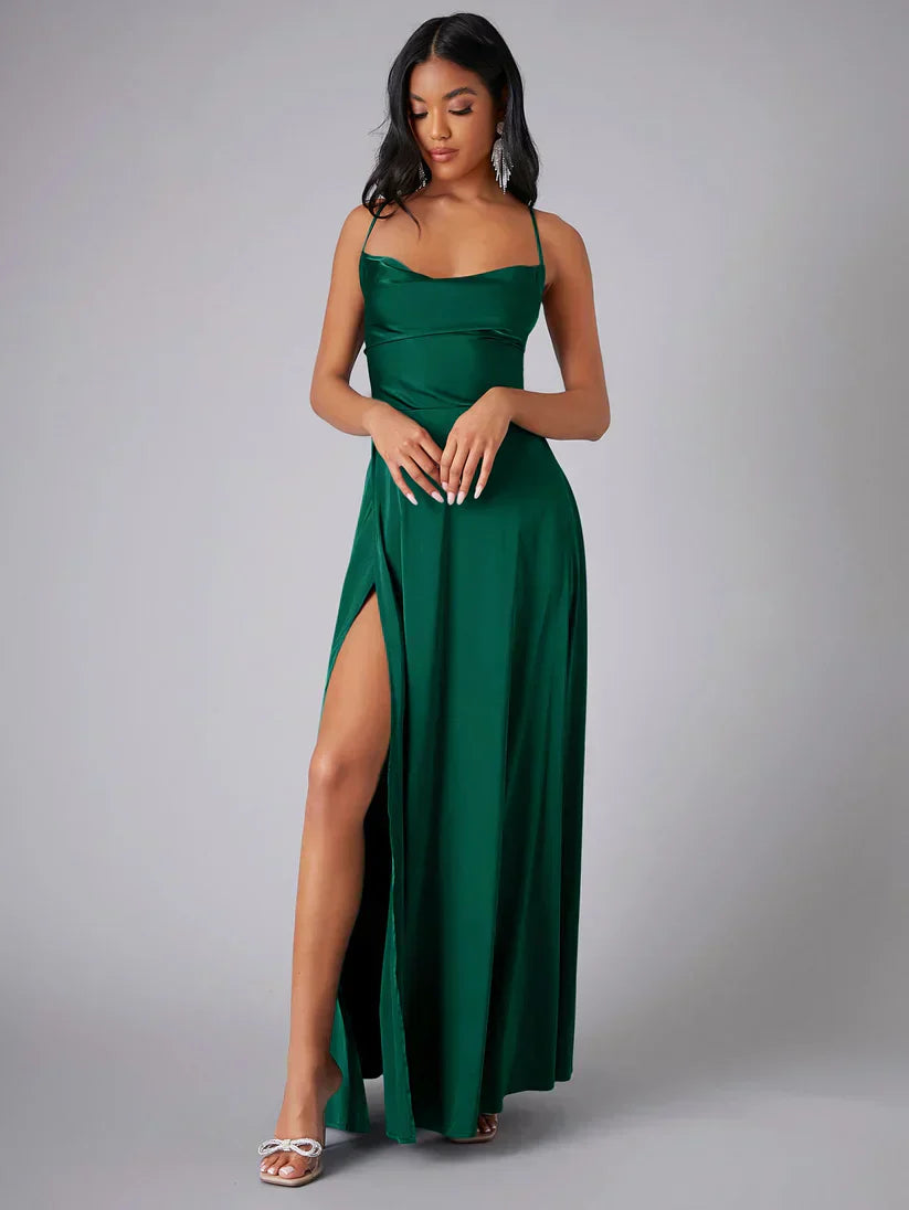 Women's flattering maxi dress featuring adjustable straps, a high leg slit, and a chic open back.