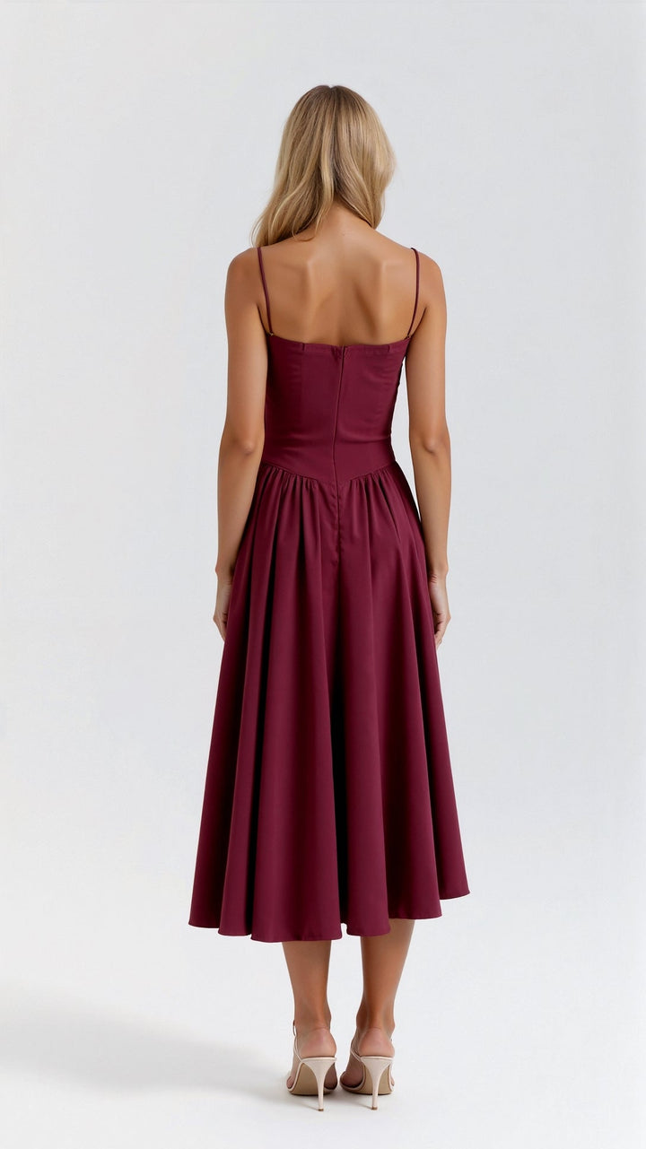 Sophisticated women's bustier midi dress with fitted bodice & pleated skirt, ideal for evening wear.