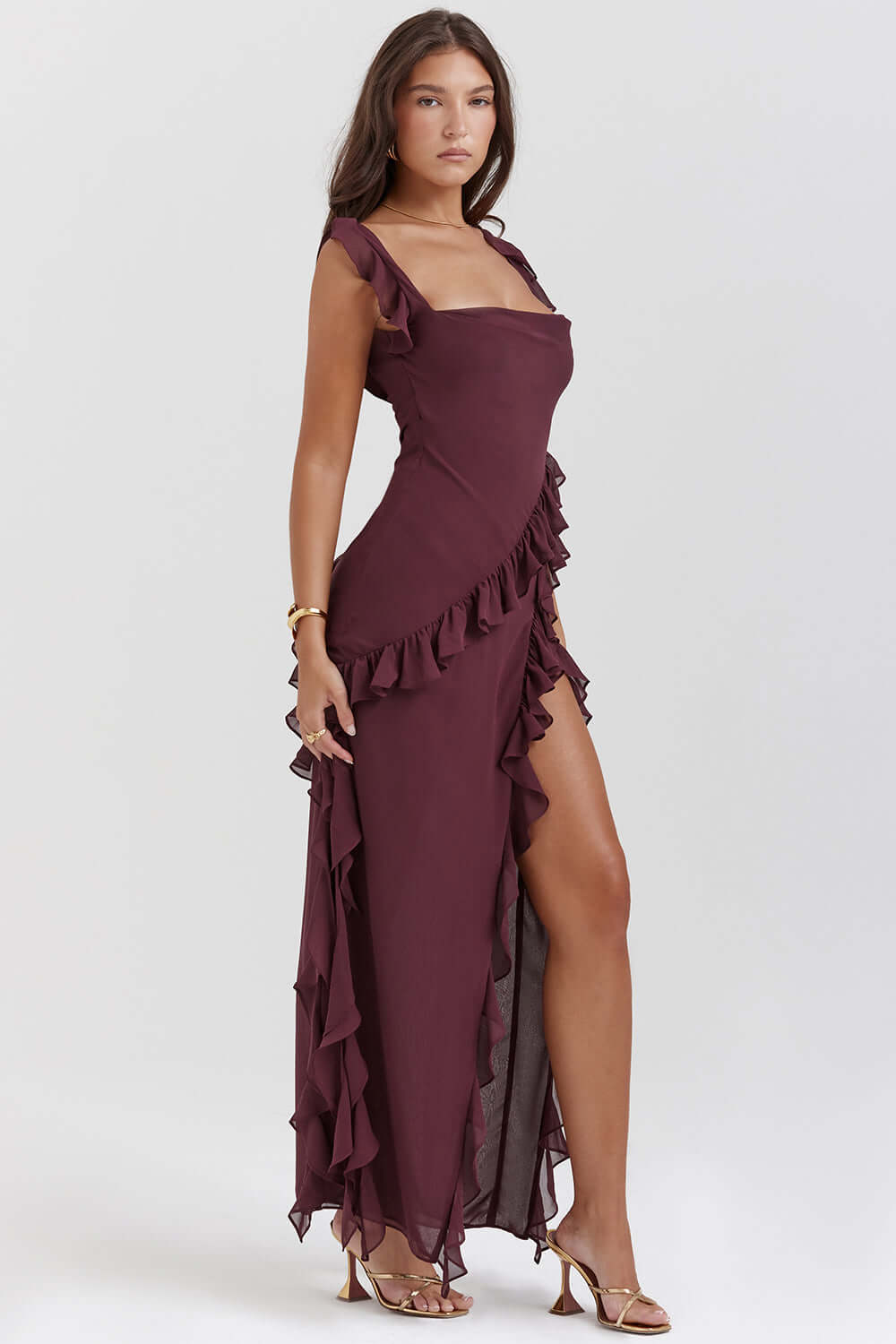 Modern woman modeling a versatile elegant midi dress, ideal for daytime chic or sophisticated evening wear.