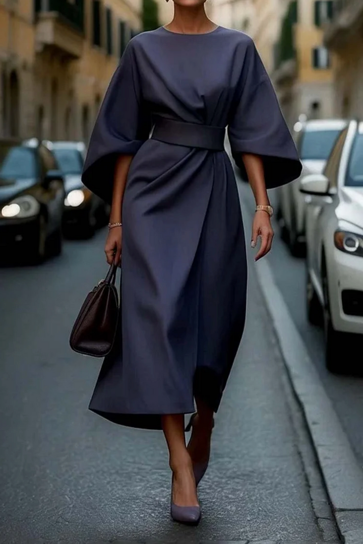 Elegant women's midi dress with flowing sleeves, perfect for a sophisticated look.