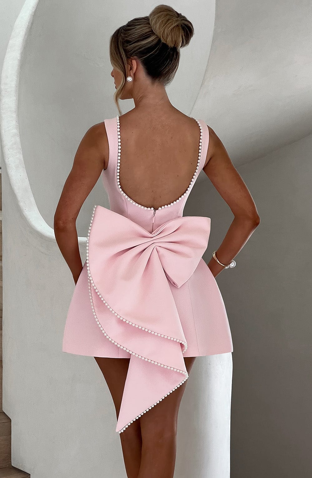 Stunning women's mini dress with an elegant bow back. Ideal as a party or cocktail dress.