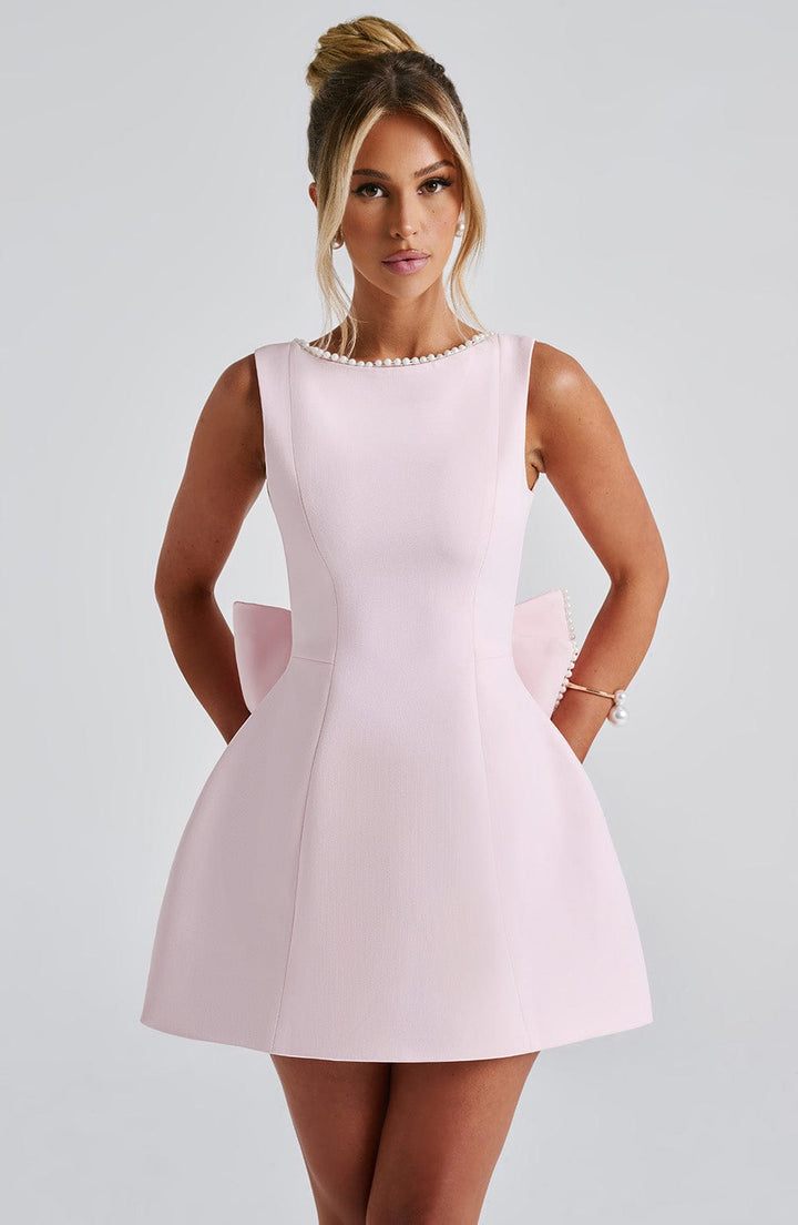 Luxurious women's mini party dress with an elegant bow-back design, perfect for date night.