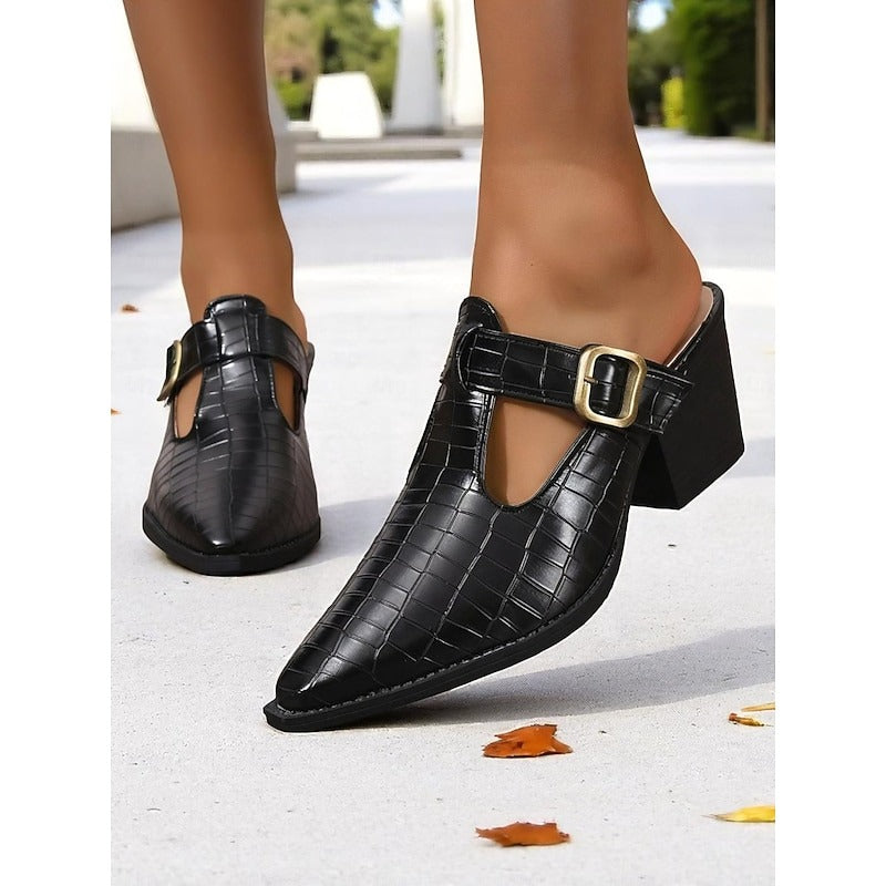 Stylish women's mules featuring a fashionable cut-out design, block heel, and buckle, for versatile footwear.