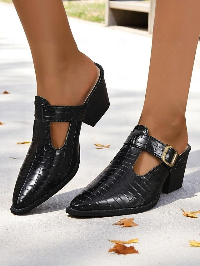 Woman wearing elegant slip-on mules with a comfortable block heel and buckle, showcasing day-to-night style.