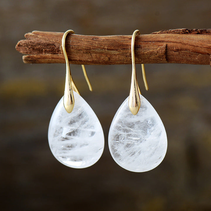 Statement elegant natural stone drop earrings. Women's teardrop dangle design, a chic fashion accessory for any occasion.
