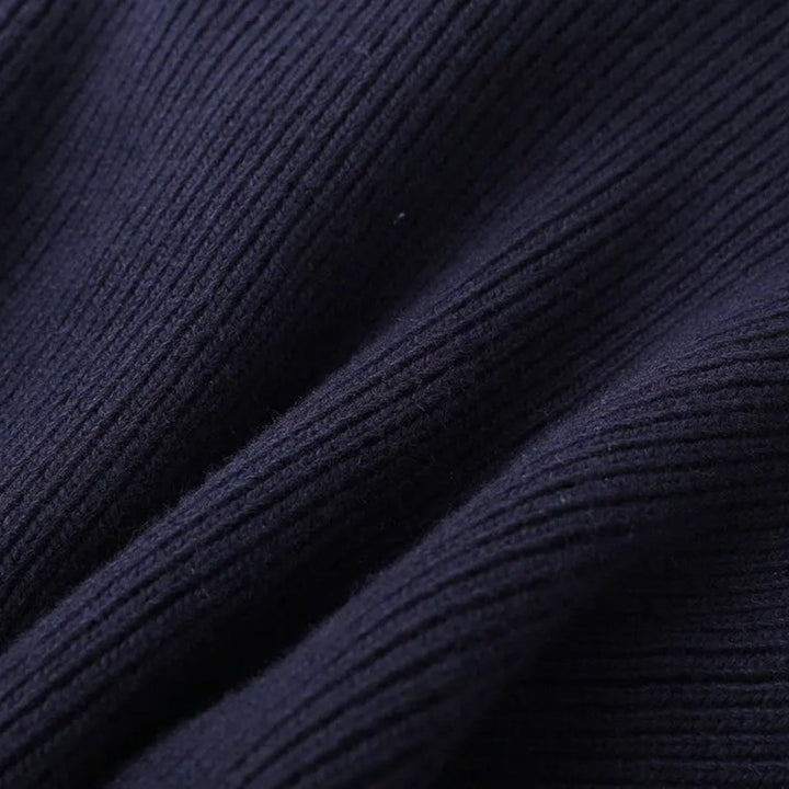 Women's elegant navy contrast trim cardigan styled open, showcasing its versatile layering for chic outfits.