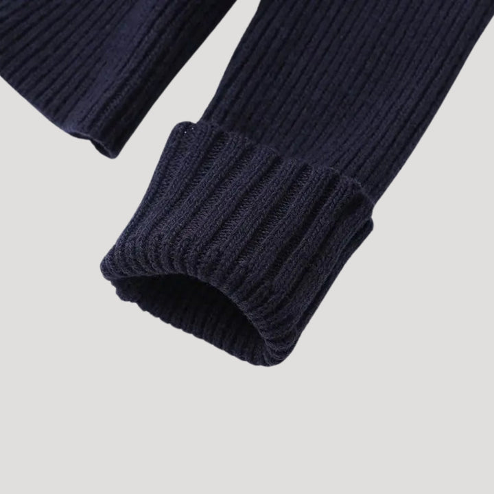 Full length view of a women's chic navy contrast trim cardigan, showcasing its flattering drape and versatile style.
