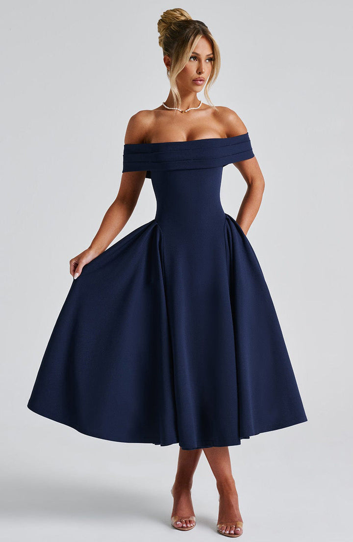 Stylish women's midi dress with an elegant off-shoulder neckline and flattering A-line cut, perfect for wedding guests.