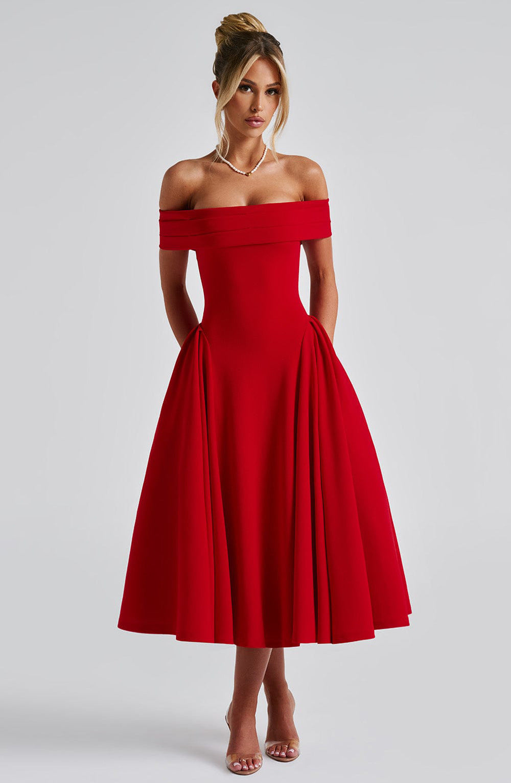 Full view of a women's elegant off-shoulder A-line midi dress, showcasing its flowing silhouette for special events.