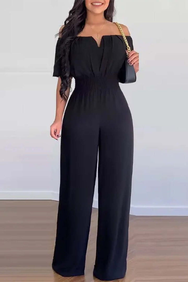 Modern women's off-shoulder short sleeve jumpsuit. This chic polyester one-piece is perfect for elegant summer fashion.
