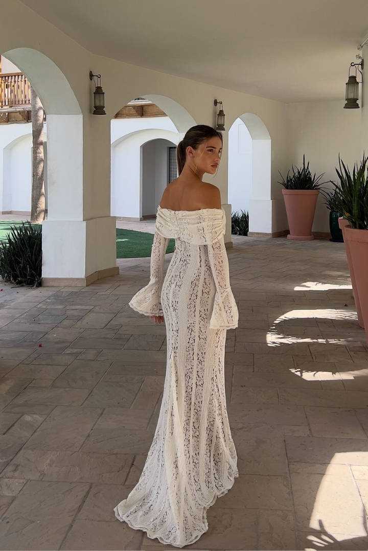 Beautiful women's off-shoulder wedding guest maxi dress in white, a sophisticated choice for formal events.