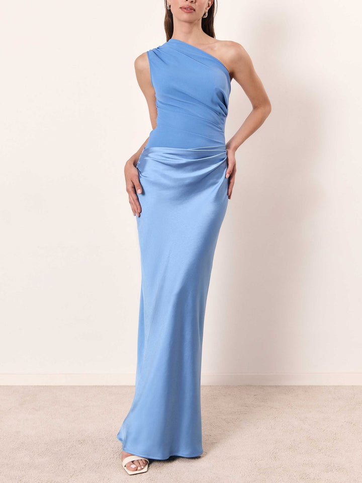 Long flowy one shoulder party dress for women, featuring elegant pleats and draped neckline.