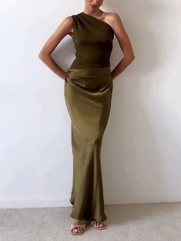 Elegant women's long one shoulder dress with beautiful pleats, perfect for sophisticated evening wear.