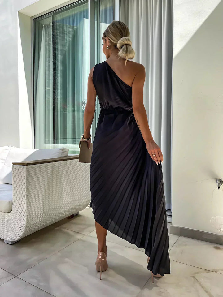 Elegant women's midi dress featuring a stylish one-shoulder design and delicate pleats for special events.