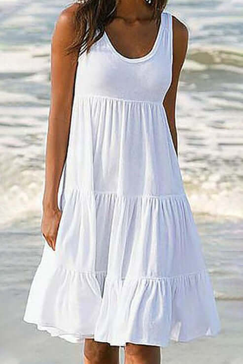 Elegant women's patchwork tiered midi dress with flowy design, perfect for versatile summer and spring fashion.