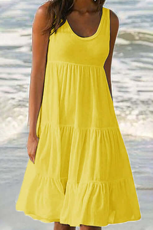 Full view of women's elegant patchwork tiered midi dress, showcasing its flattering flowy silhouette.