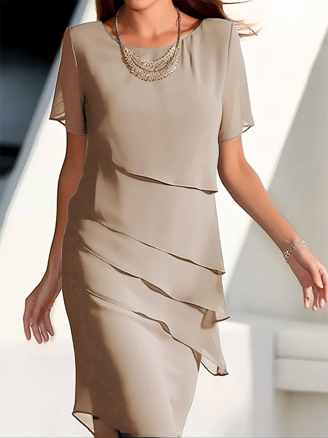Flowy pleated chiffon midi dress for women, a stylish and elegant summer party dress with beautiful movement.