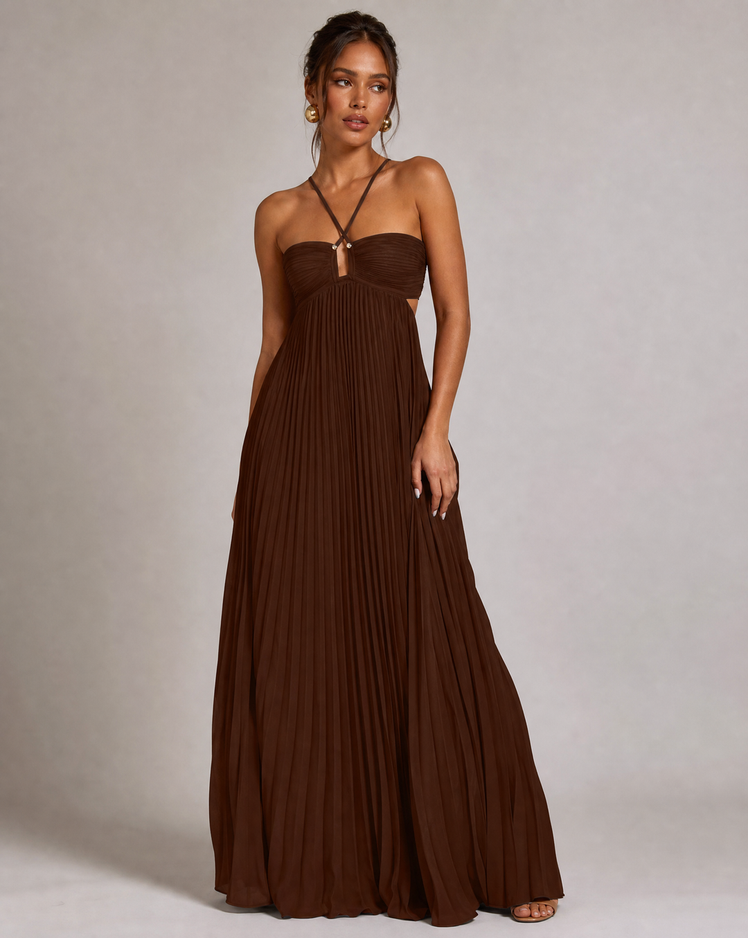 Chic women's halter neck maxi dress with elegant pleats & open back, ideal for summer parties.