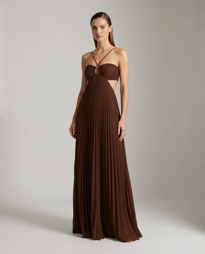 Flowing pleated maxi dress for women, with a stylish halter neck. Elegant summer or occasion wear.