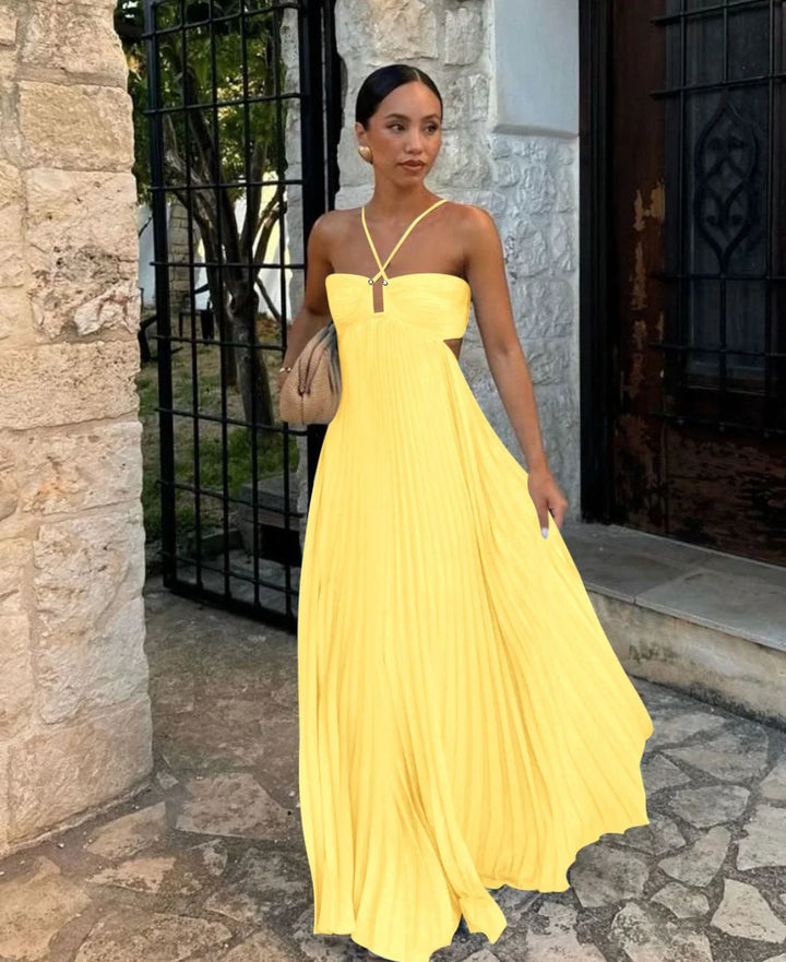 Women's elegant pleated halter neck maxi dress, a chic design for special occasions or summer events.