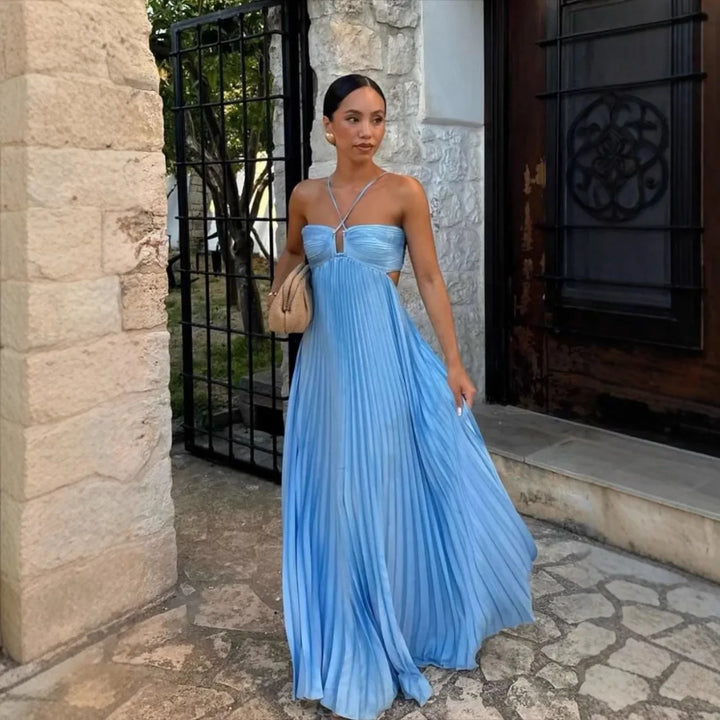 Stunning women's pleated halter neck maxi dress with open back detail. Elegant & chic for summer parties.