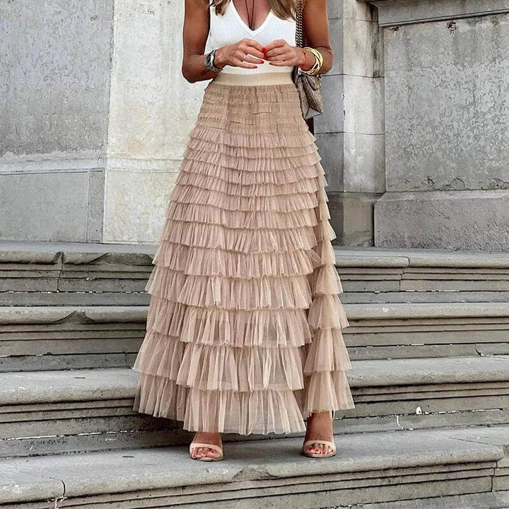 Elegant women's pleated mesh midi skirt with chic ruffle detail, perfect for spring/summer fashion.