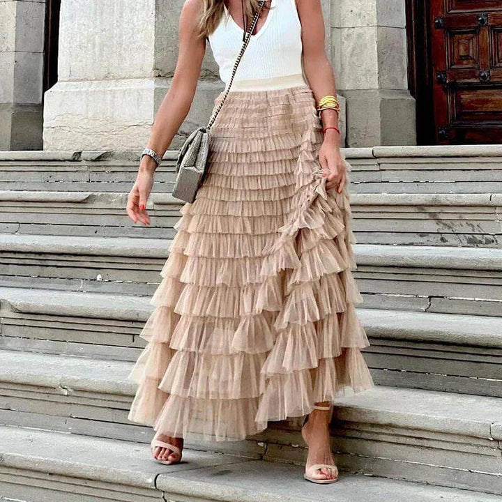 Feminine women's pleated mesh midi skirt, versatile for dressy or casual elegant outfits.