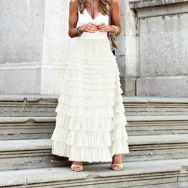 Chic women's mesh midi skirt featuring delicate pleats and stylish ruffle trim for an elevated look.
