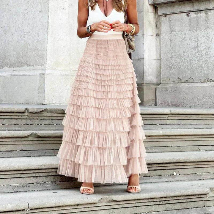 Fashionable women's spring/summer pleated mesh midi skirt with elegant ruffle detail for any occasion.