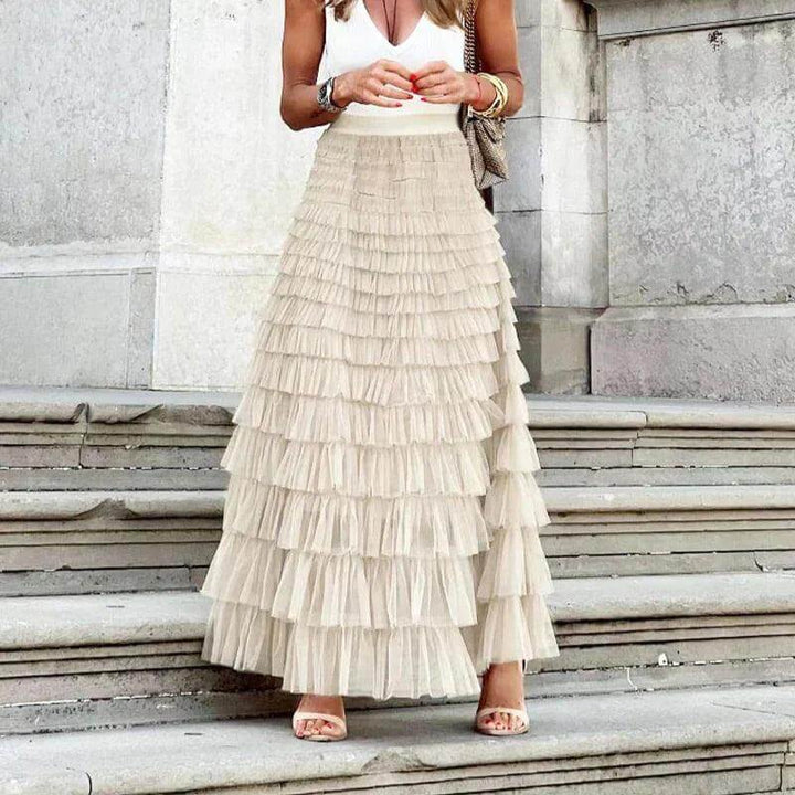 Sophisticated women's pleated mesh midi skirt, offering a blend of elegance and feminine style.