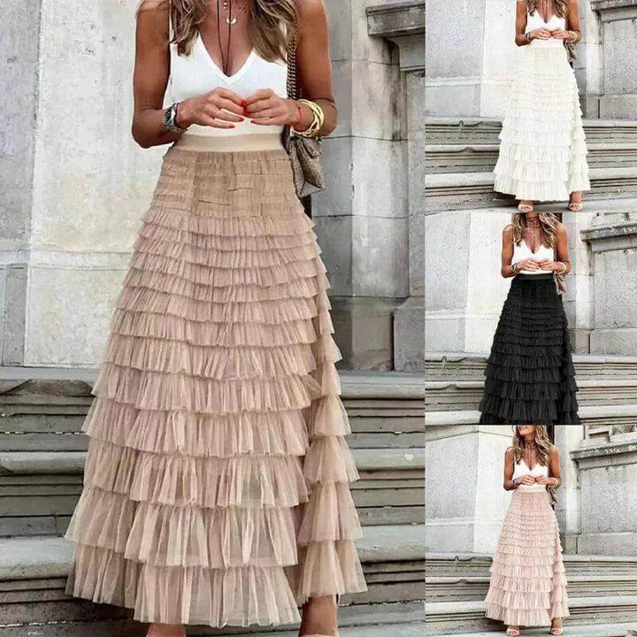Stylish women's midi skirt: elegant pleated mesh with a chic ruffle, ideal for contemporary fashion.