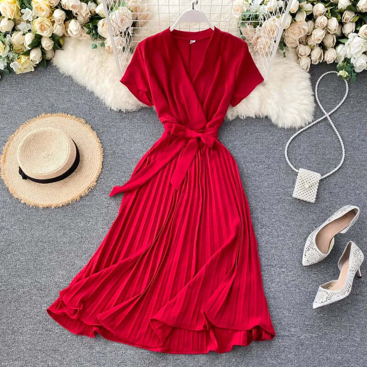 Comfortable khaki pleated midi dress for women, ideal for versatile styling and sophisticated summer looks.
