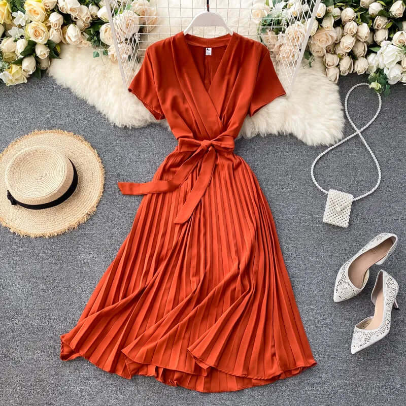 Versatile women's midi dress with elegant pleats, offering chic comfort for various occasions.