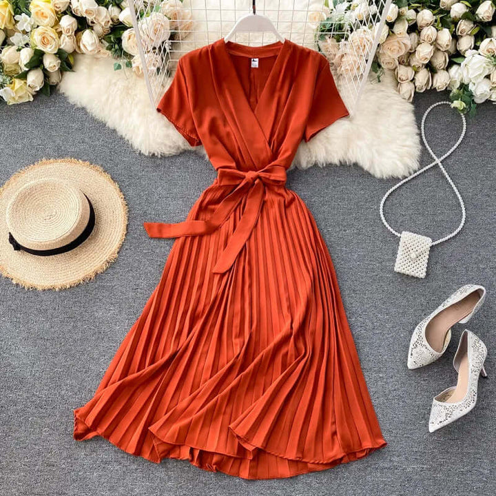 Versatile women's midi dress with elegant pleats, offering chic comfort for various occasions.