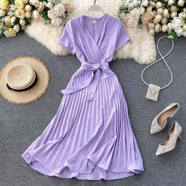 Elegant pleated midi dress, a versatile women's summer outfit or event wear for sophisticated style.