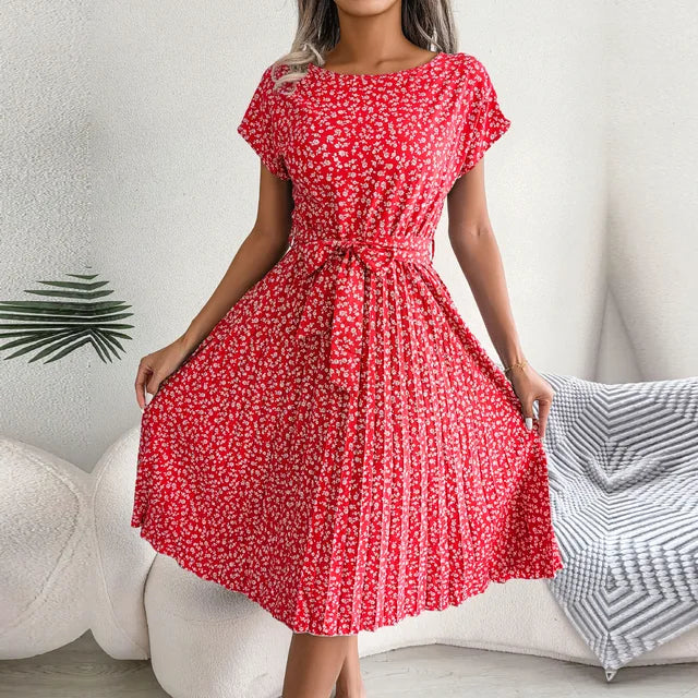 Chic women's pleated midi dress with waist tie, perfect for elegant spring and summer occasions.