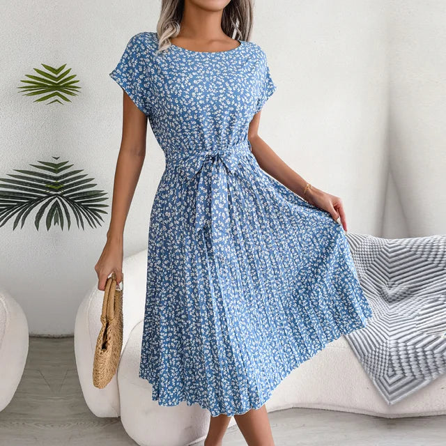 Stylish women's elegant pleated midi dress in a vibrant color with short sleeves & waist tie.