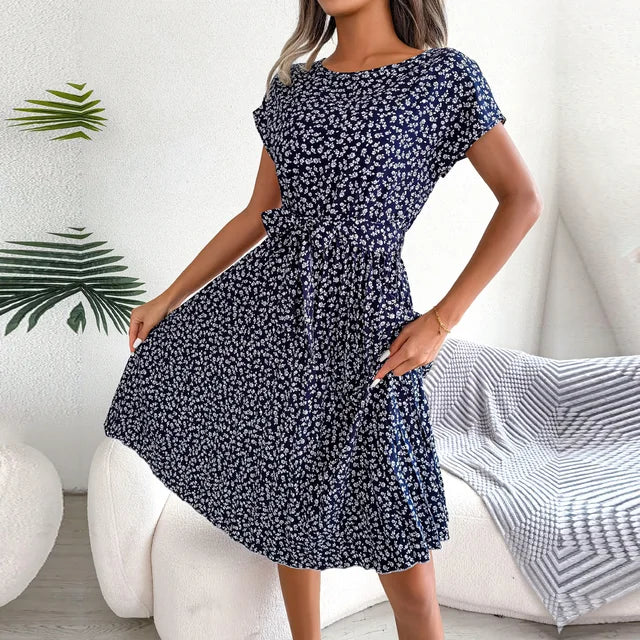 Spring/Summer elegant pleated midi dress for women, with flattering short sleeves & waist tie.