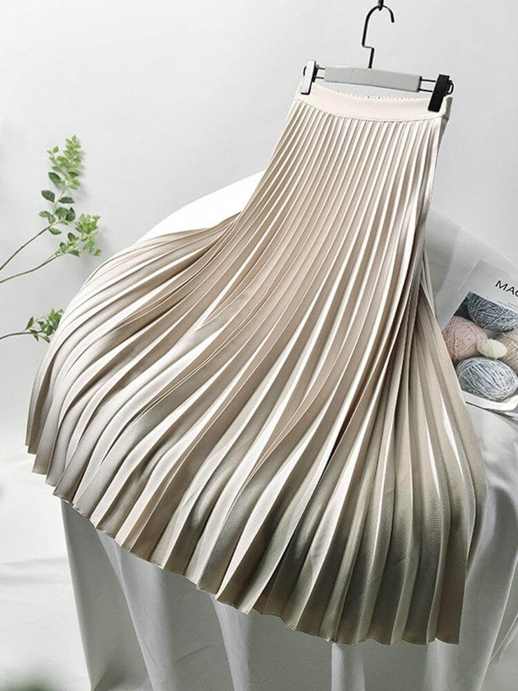 Elegant women's pleated midi skirt, high-waisted and flowy, perfect for chic versatile fashion.