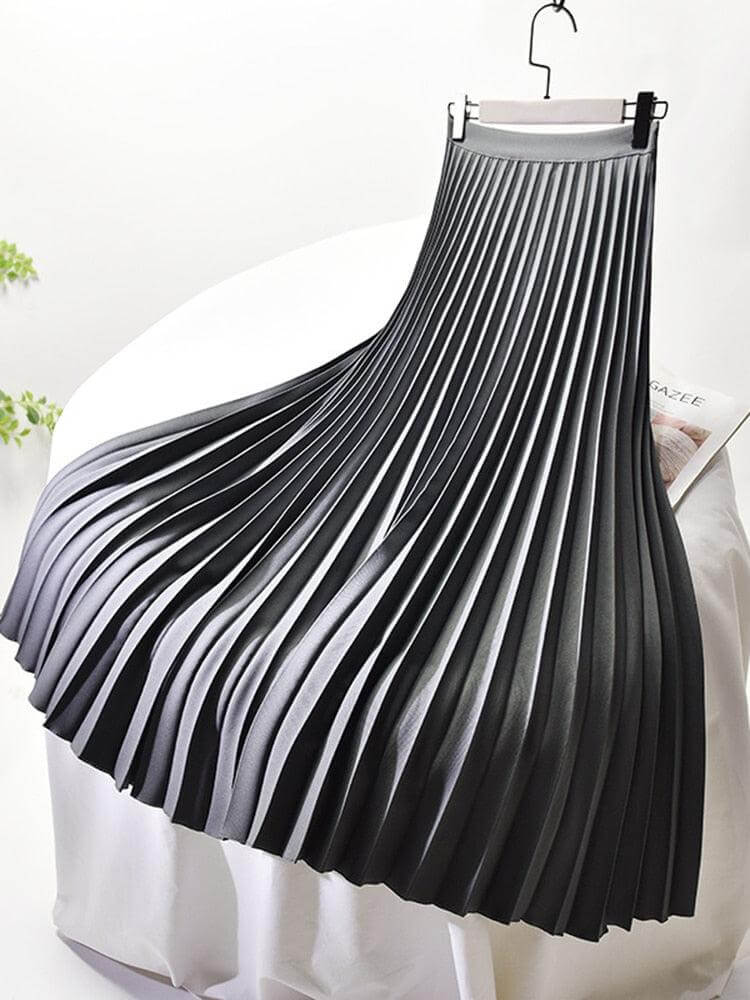 Stylish women's elegant pleated midi skirt, high-waisted and flowy, a key piece for spring fashion.