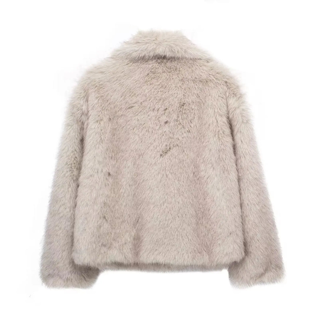 Stylish women's long-sleeve plush winter coat, offering elegant warmth and luxurious comfort for fashionable outerwear.