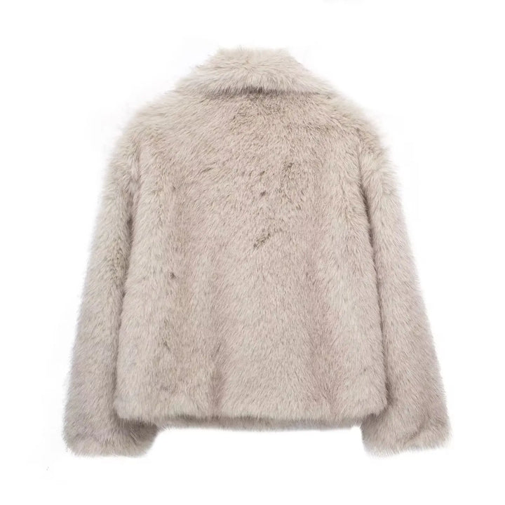 Stylish women's long-sleeve plush winter coat, offering elegant warmth and luxurious comfort for fashionable outerwear.