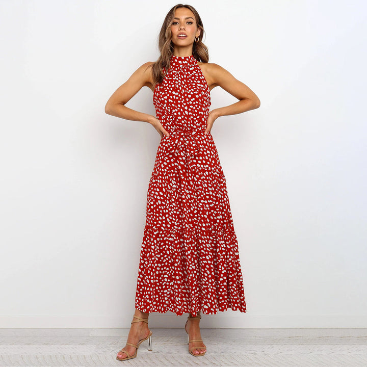 Flowy polka dot halter neck maxi dress for women, ideal for elegant summer casual wear.