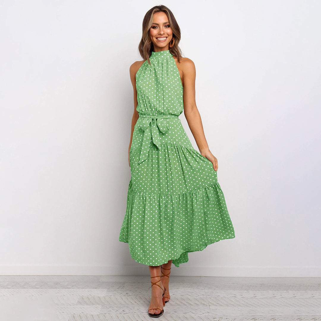 Stunning women's polka dot halter maxi dress with an elegant, flowy silhouette for summer.